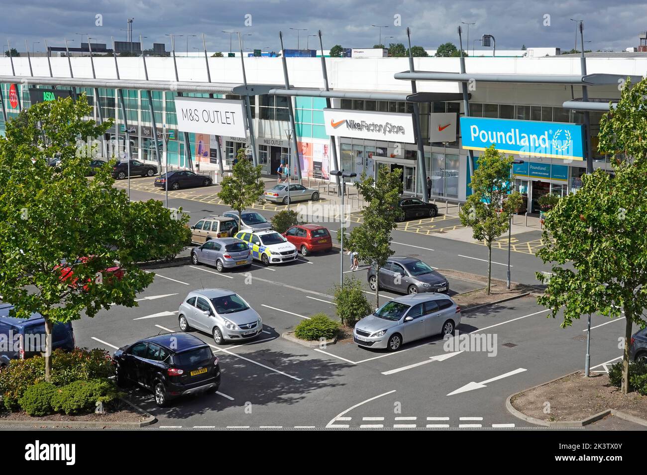Aerial view retail business shop units for M&S Outlet Nick Factory Store & Poundland in Thurrock Shopping Park free customer car park Essex England UK Stock Photo
