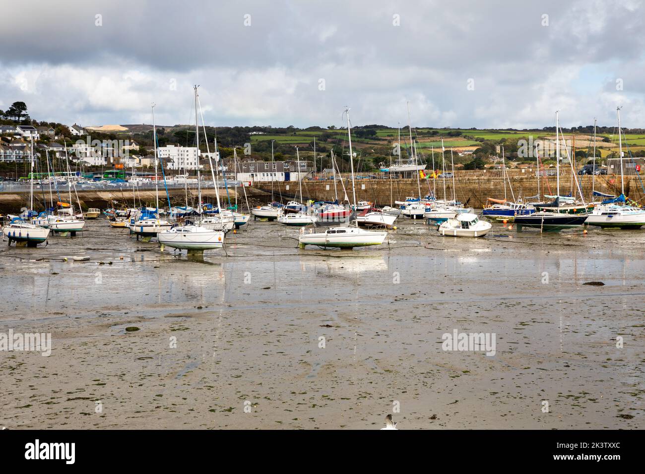 Penzance,Cornwall,28th September 2022,Grey, cloudy dismal weather above the boats at low tide in Penzance, Cornwall. The temperature was only 12C with light rain showers and a moderate breeze, it is forecast to be dull and wet for the rest of the week.Credit: Keith Larby/Alamy Live News Stock Photo