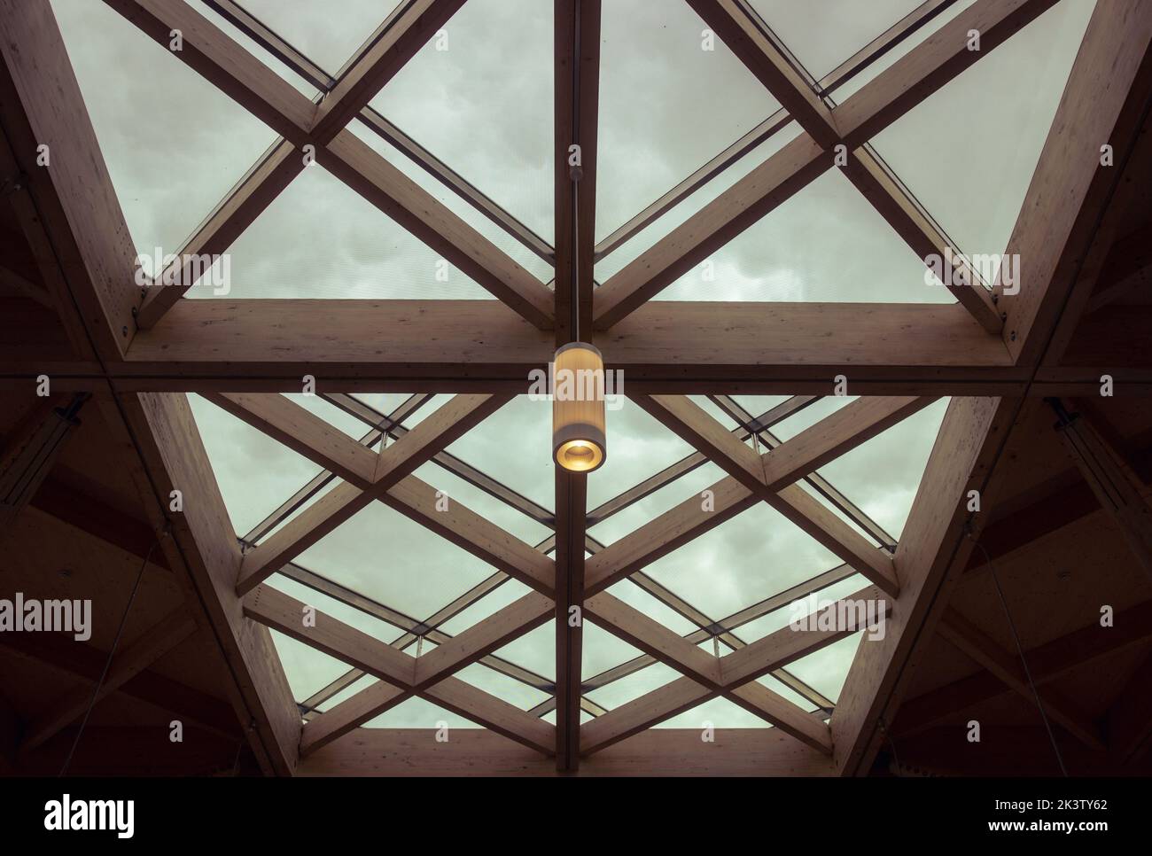 A single lampshade hanging from an ornate glass ceiling Stock Photo Alamy