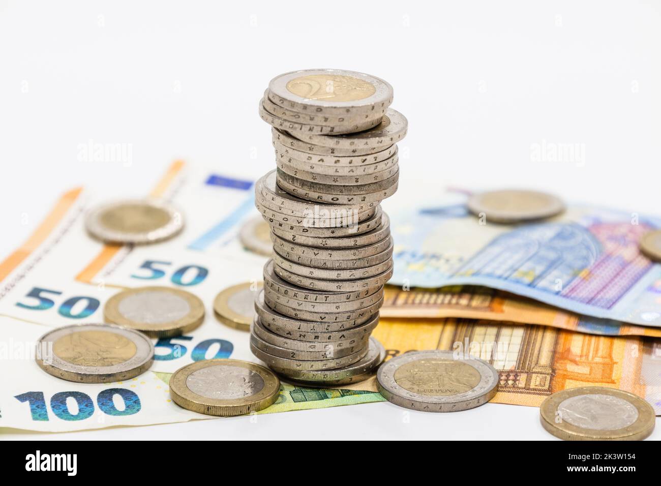 The pile of euro coins on euro notes. Euro banknotes and coins Stock Photo