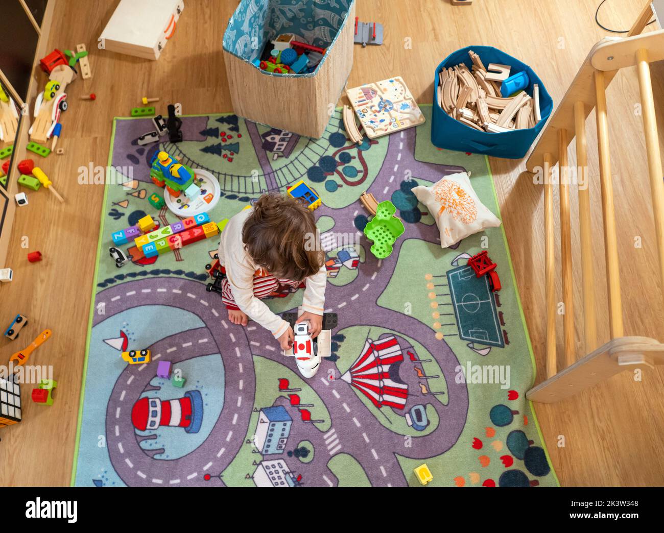 Baby Boy 2yo playing home with tos Stock Photo