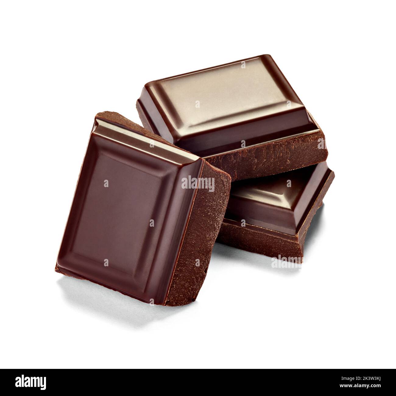 close up of chocolate pieces stack on white background Stock Photo - Alamy