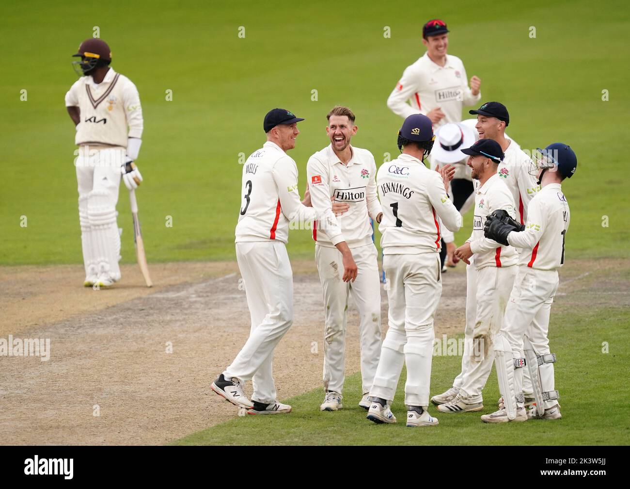 Lancashire's Tom Bailey celebrates the wicket of Surrey's Jordan Clarke with team-mates during day three of the LV= Insurance County Championship, Division one match at Emirates Old Trafford, Manchester. Picture date: Wednesday September 28, 2022. Stock Photo