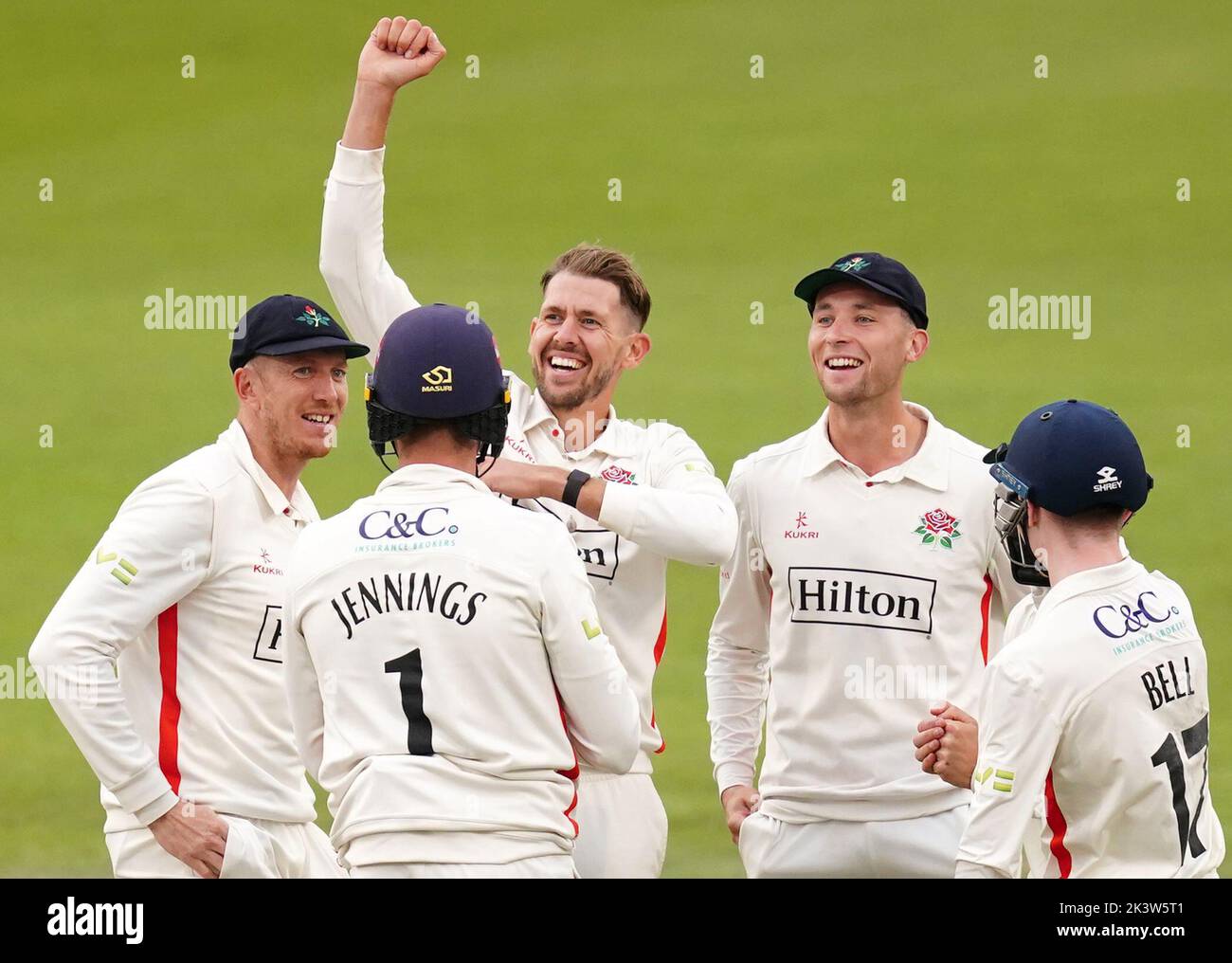 Lancashire's Tom Bailey (third left) celebrates the wicket of Surrey's Jordan Clarke with team-mates during day three of the LV= Insurance County Championship, Division one match at Emirates Old Trafford, Manchester. Picture date: Wednesday September 28, 2022. Stock Photo