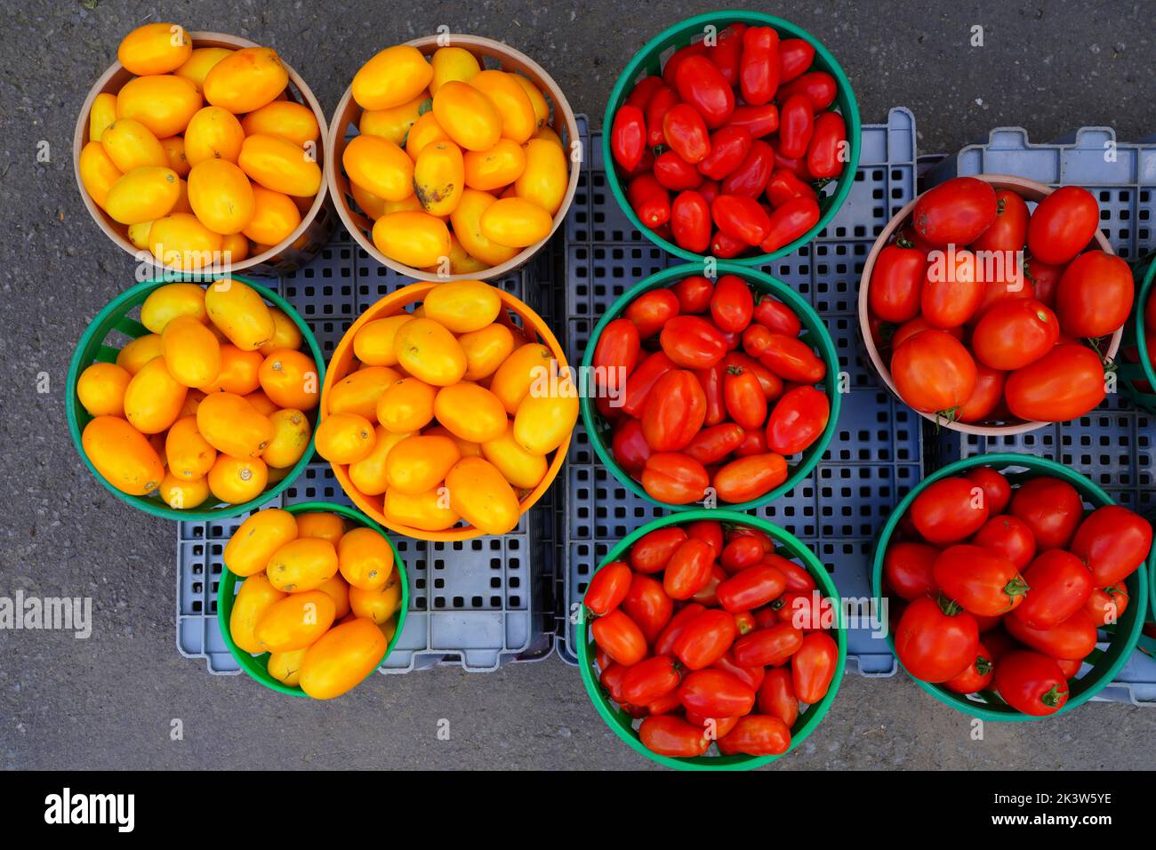Baskets of colorful cherry tomatoes at the farmers market Stock Photo