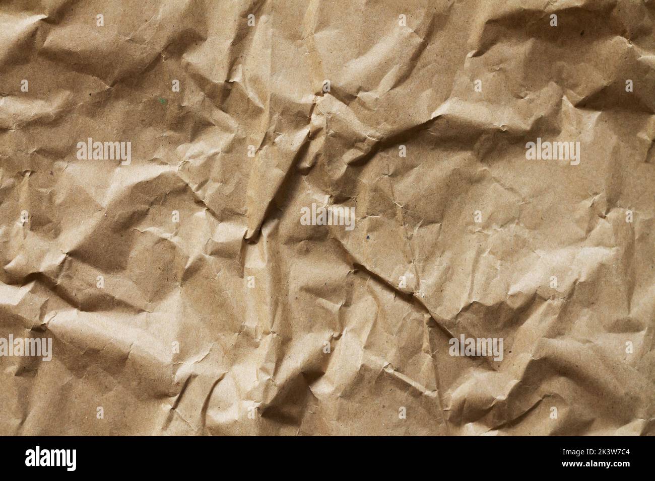 Crumpled old brown craft paper background texture Stock Photo