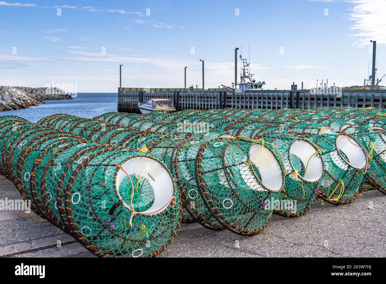 Fishing traps stacked on the pier. Ste-Anne-des-Monts, Gaspesia, Quebec, Canada. Commercial fishing dock. Stock Photo