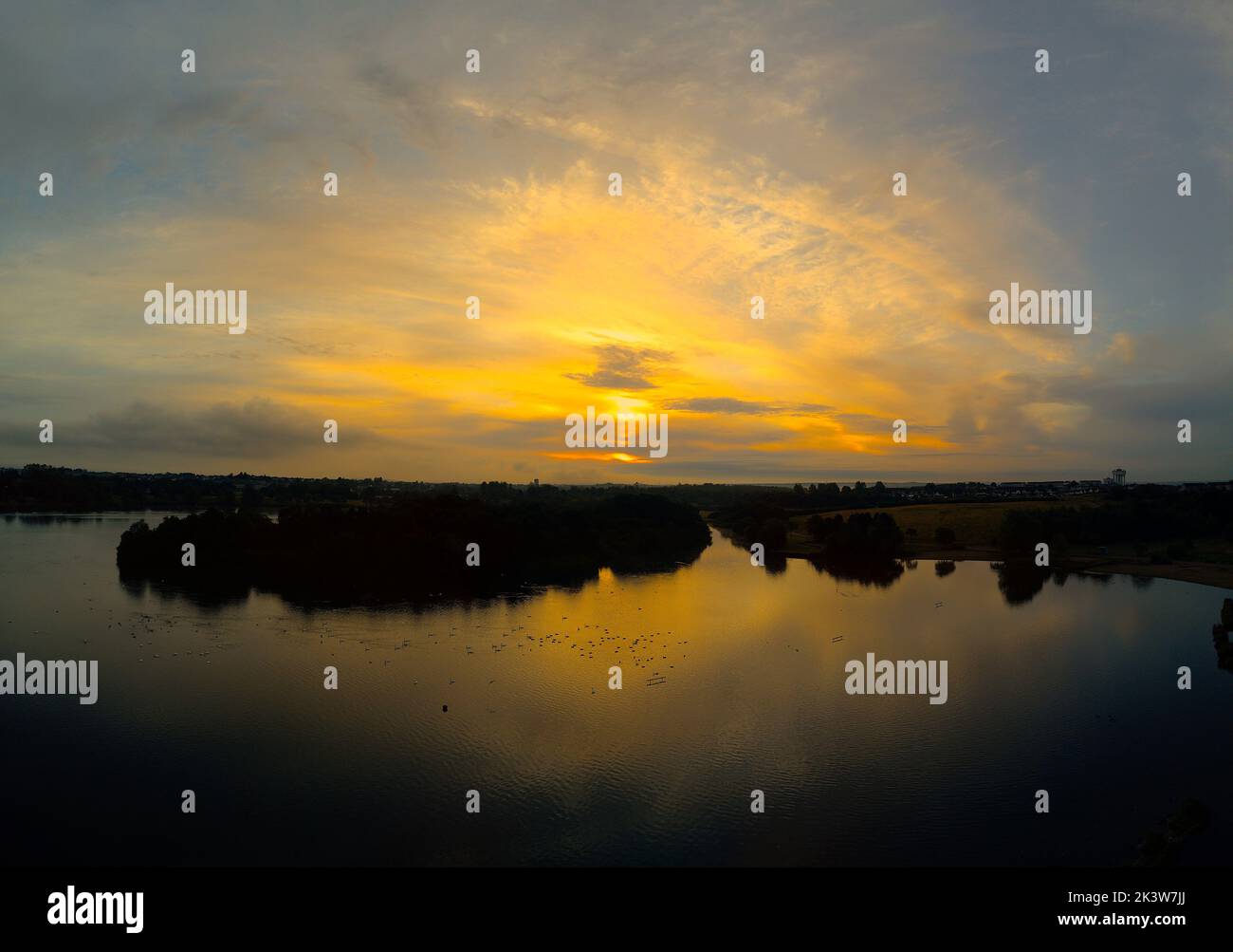 sunrise over water Stock Photo