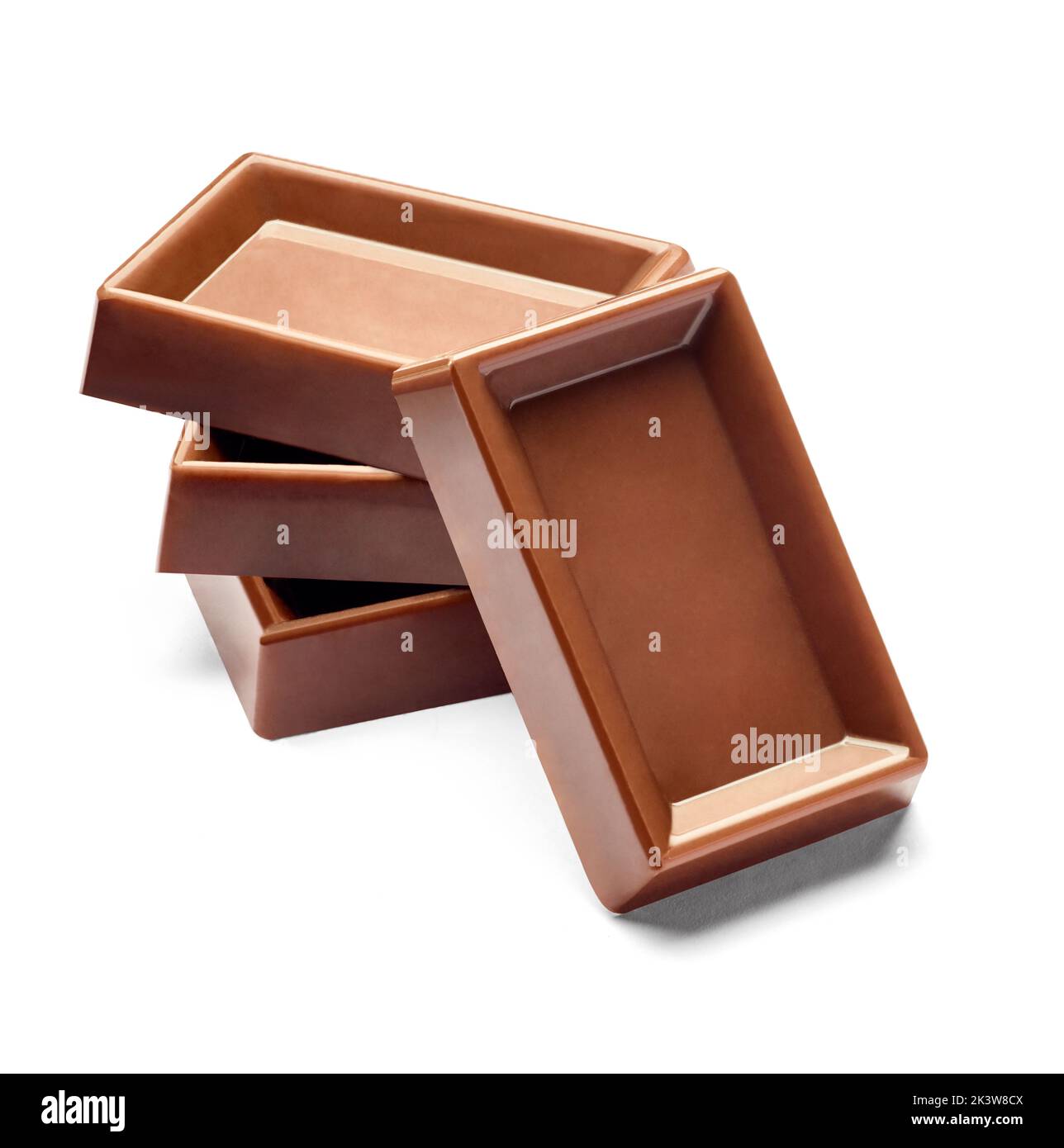 close up of chocolate pieces stack on white background Stock Photo - Alamy