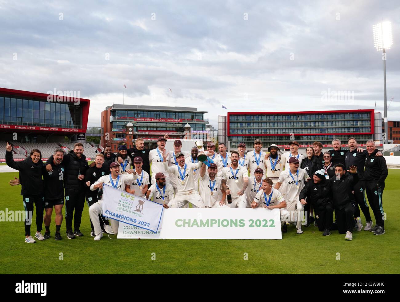 Lancashire players and staff celebrate with the trophy following day three of the LV= Insurance County Championship, Division one match at Emirates Old Trafford, Manchester. Picture date: Wednesday September 28, 2022. Stock Photo
