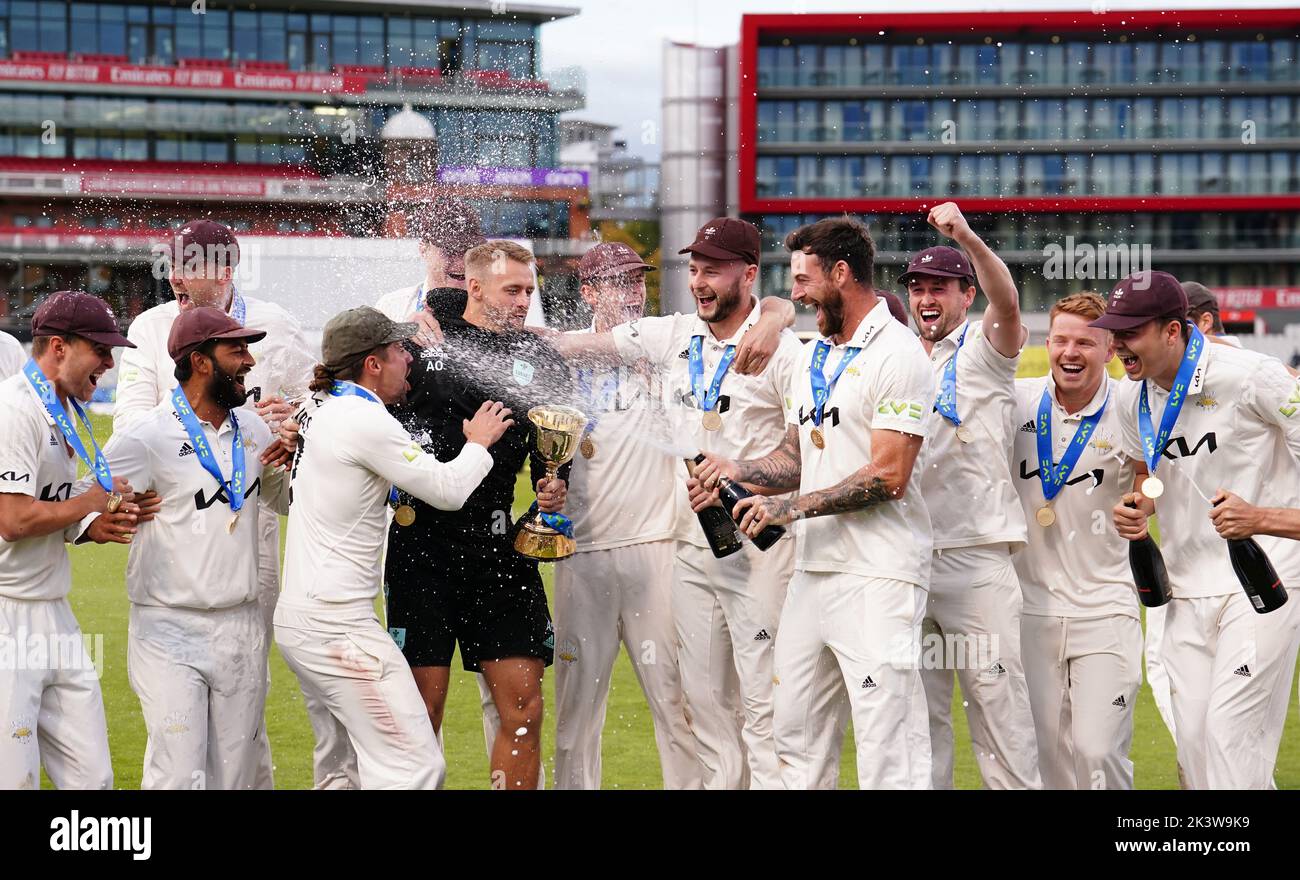 Lancashire players celebrate with the trophy following day three of the LV= Insurance County Championship, Division one match at Emirates Old Trafford, Manchester. Picture date: Wednesday September 28, 2022. Stock Photo