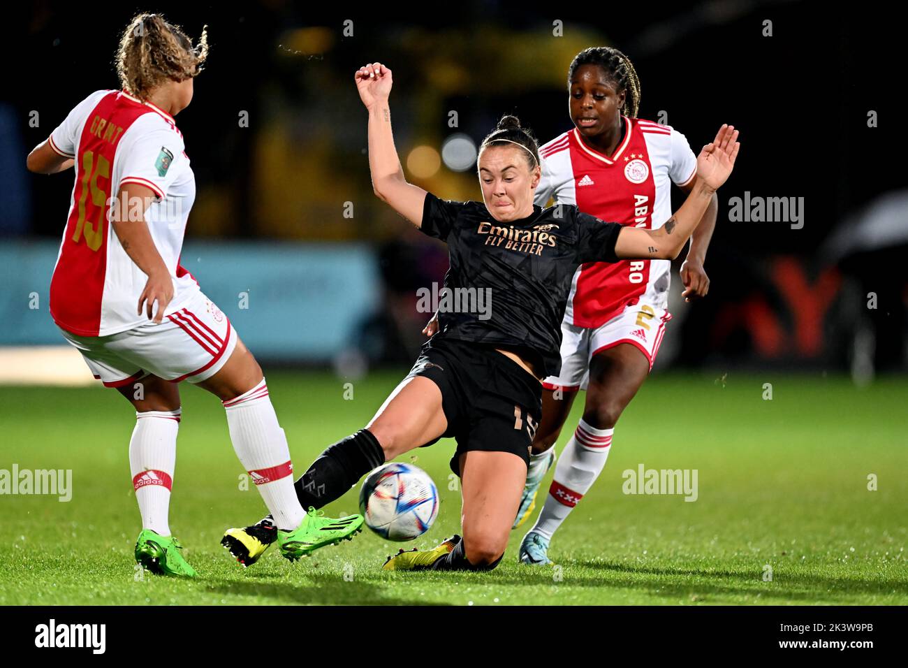 AMSTERDAM - (lr) Caitlin Foord of Arsenal WFC, Liza van der Most of Ajax women during the UEFA Champions League women's match between Ajax Amsterdam and Arsenal FC at De Toekomst sports complex on September 28, 2022 in Amsterdam, Netherlands. ANP GERRIT VAN COLOGNE Stock Photo