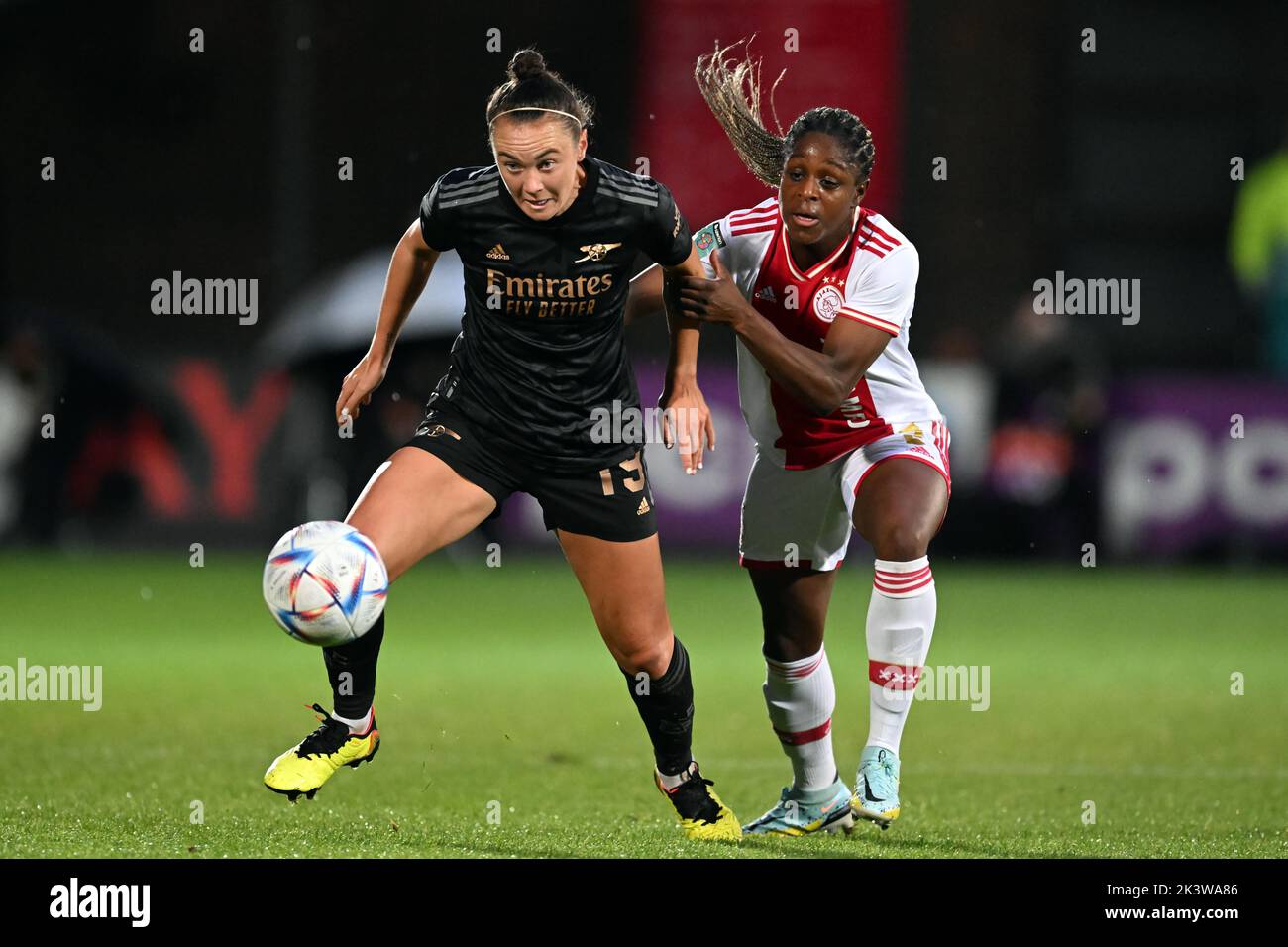 AMSTERDAM - (lr) Caitlin Foord of Arsenal WFC, Liza van der Most of Ajax women during the UEFA Champions League women's match between Ajax Amsterdam and Arsenal FC at De Toekomst sports complex on September 28, 2022 in Amsterdam, Netherlands. ANP GERRIT VAN COLOGNE Stock Photo