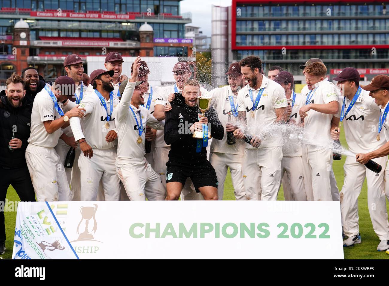 Surrey players celebrate with the trophy following day three of the LV= Insurance County Championship, Division one match at Emirates Old Trafford, Manchester. Picture date: Wednesday September 28, 2022. Stock Photo
