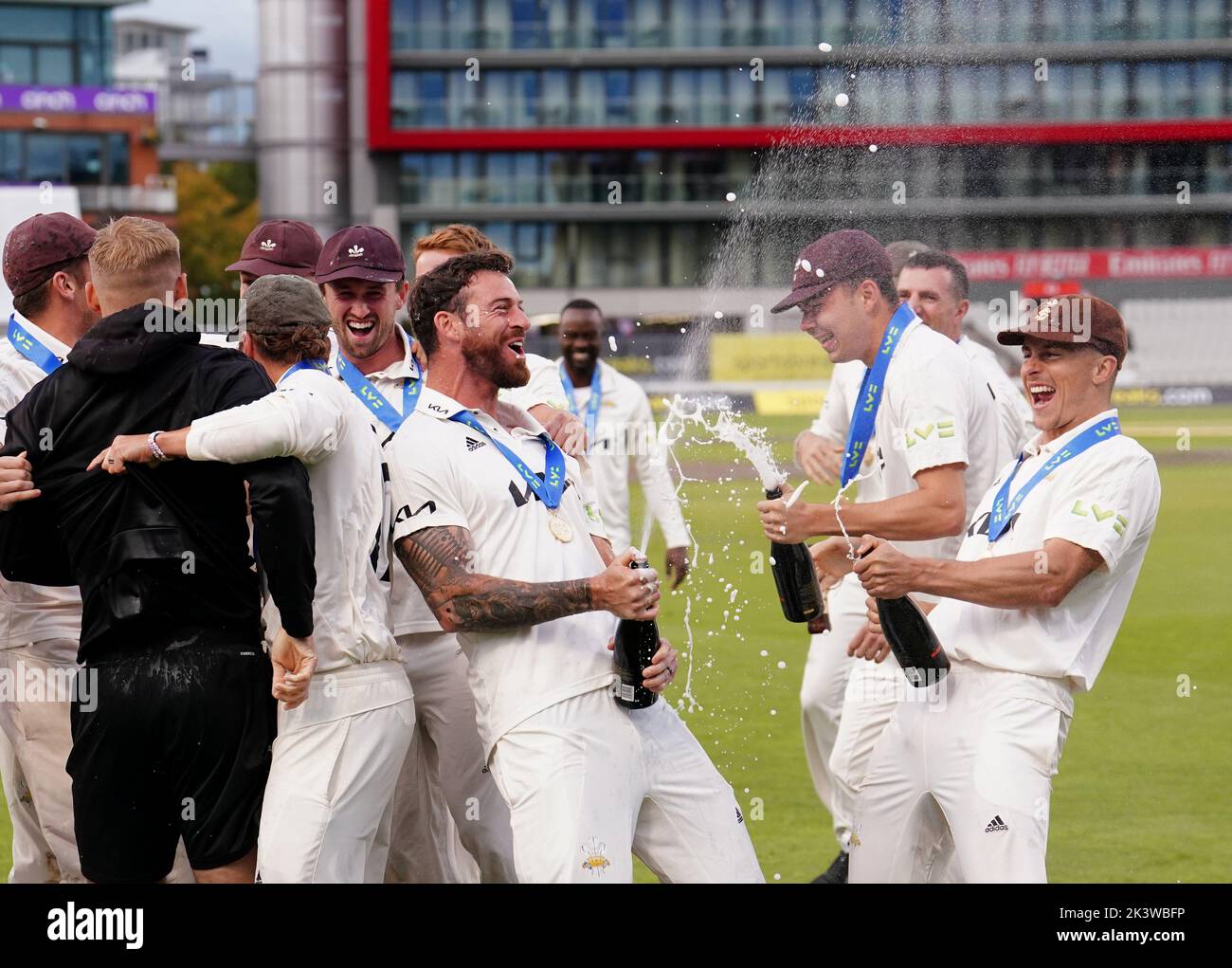 Surrey players celebrate with the trophy following day three of the LV= Insurance County Championship, Division one match at Emirates Old Trafford, Manchester. Picture date: Wednesday September 28, 2022. Stock Photo