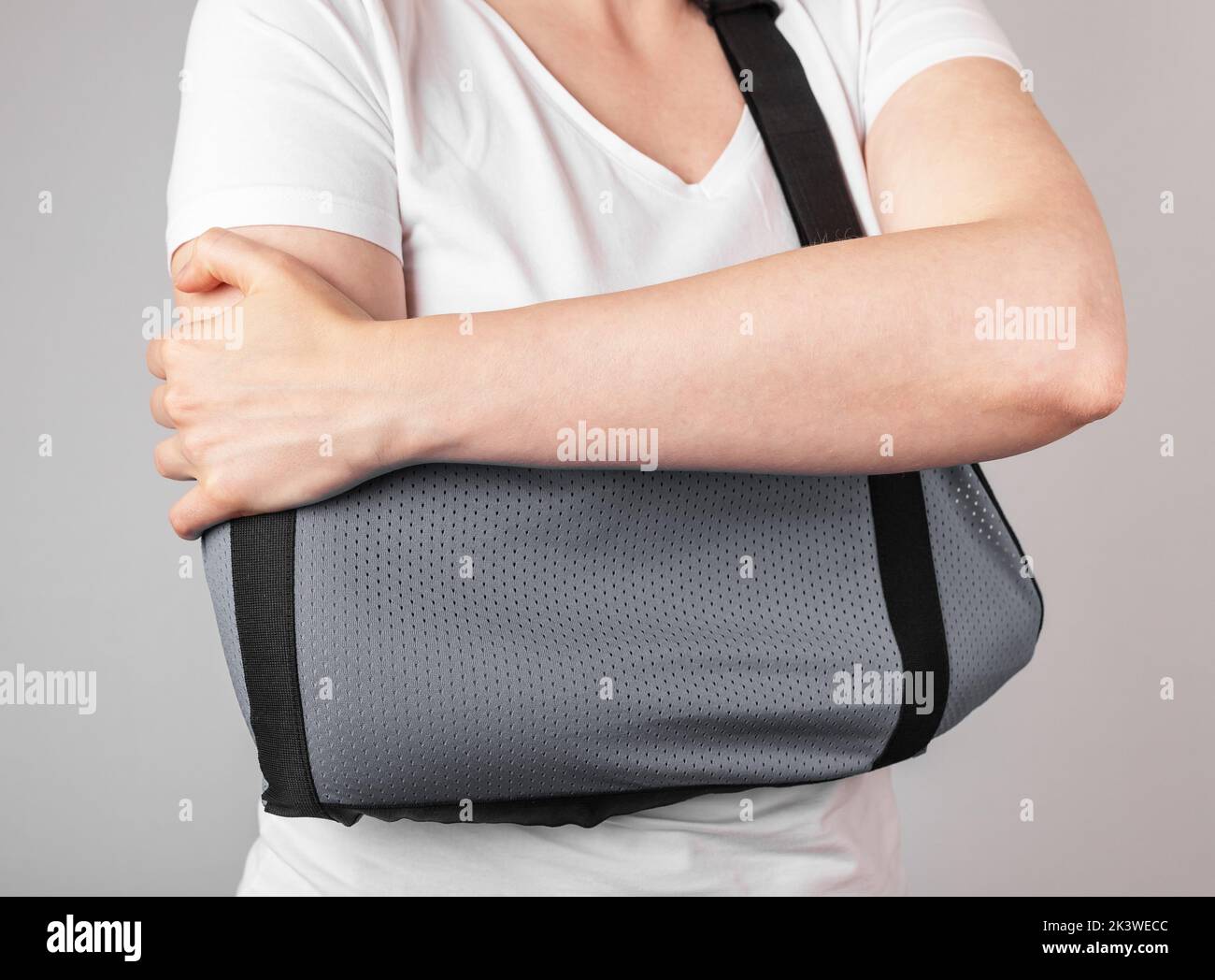 Wearing sling for injured arm, hand, shoulder. High quality photo Stock Photo