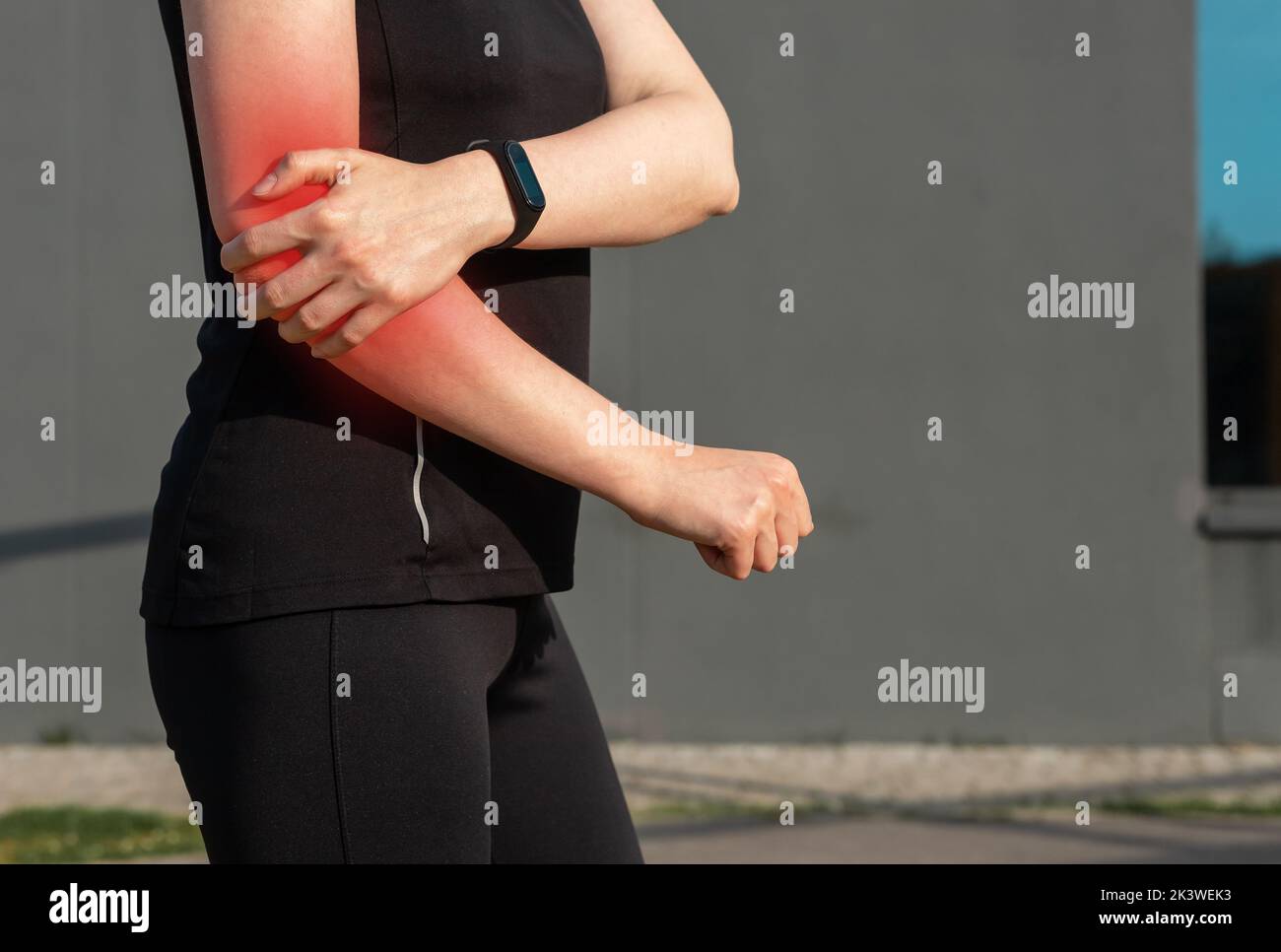 Elbow pain, sport trauma of woman athlete. High quality photo Stock Photo