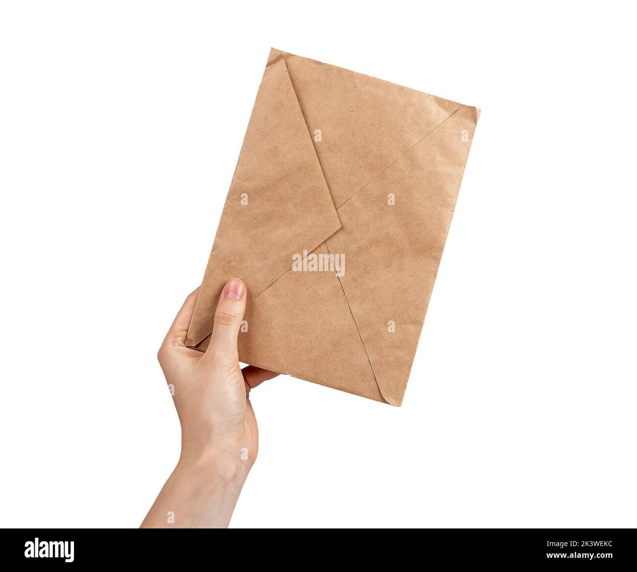 Craft paper envelope in hand isolated on white. High quality photo Stock Photo