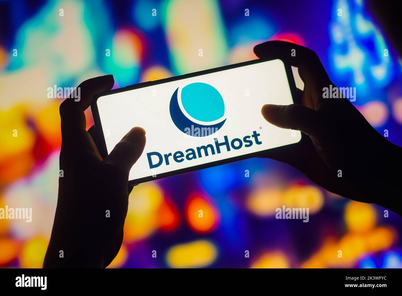 In this photo illustration, the DreamHost logo is seen displayed on a smartphone. Stock Photo