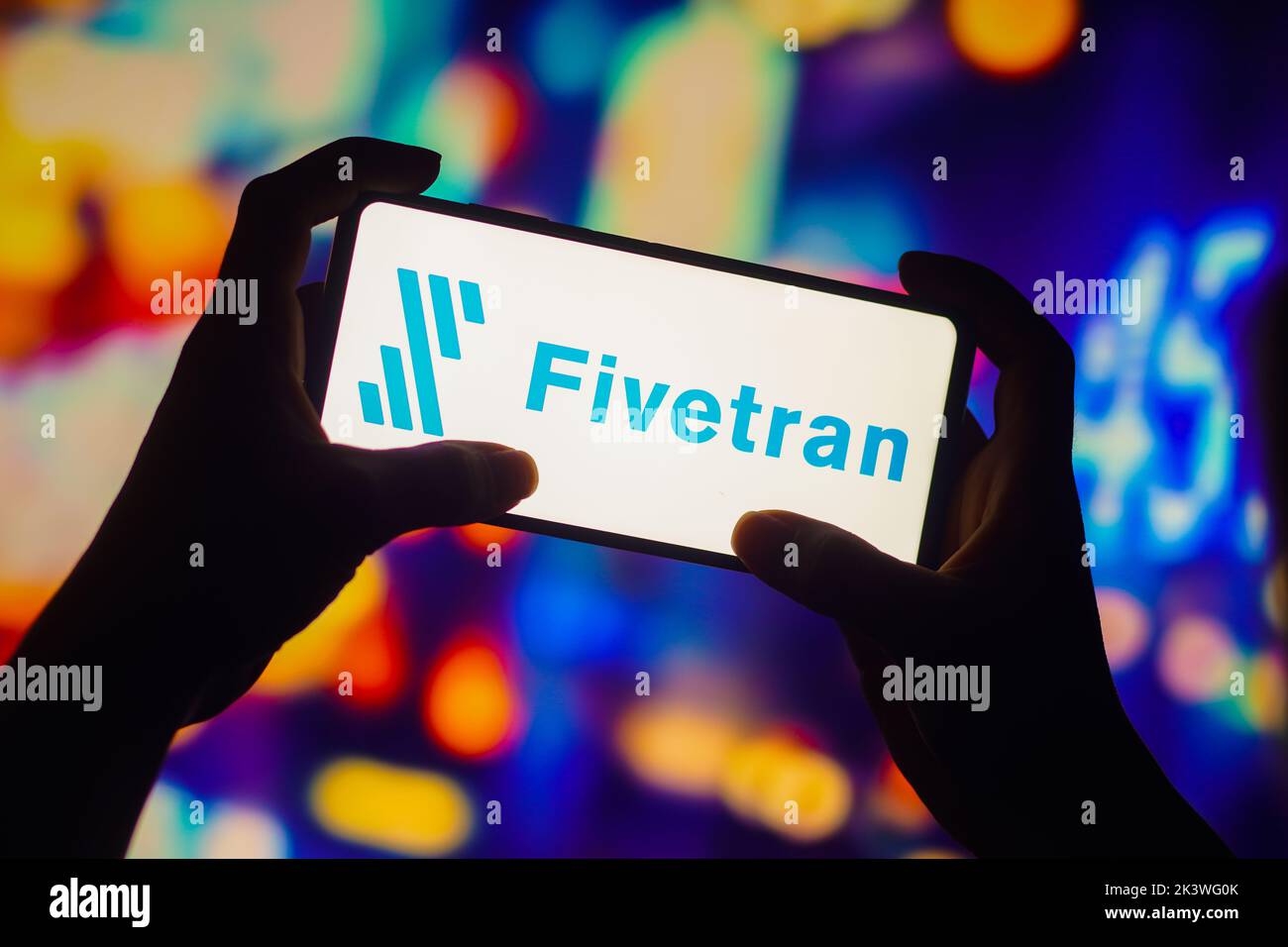 In this photo illustration, the Fivetran logo is seen displayed on a smartphone. Stock Photo