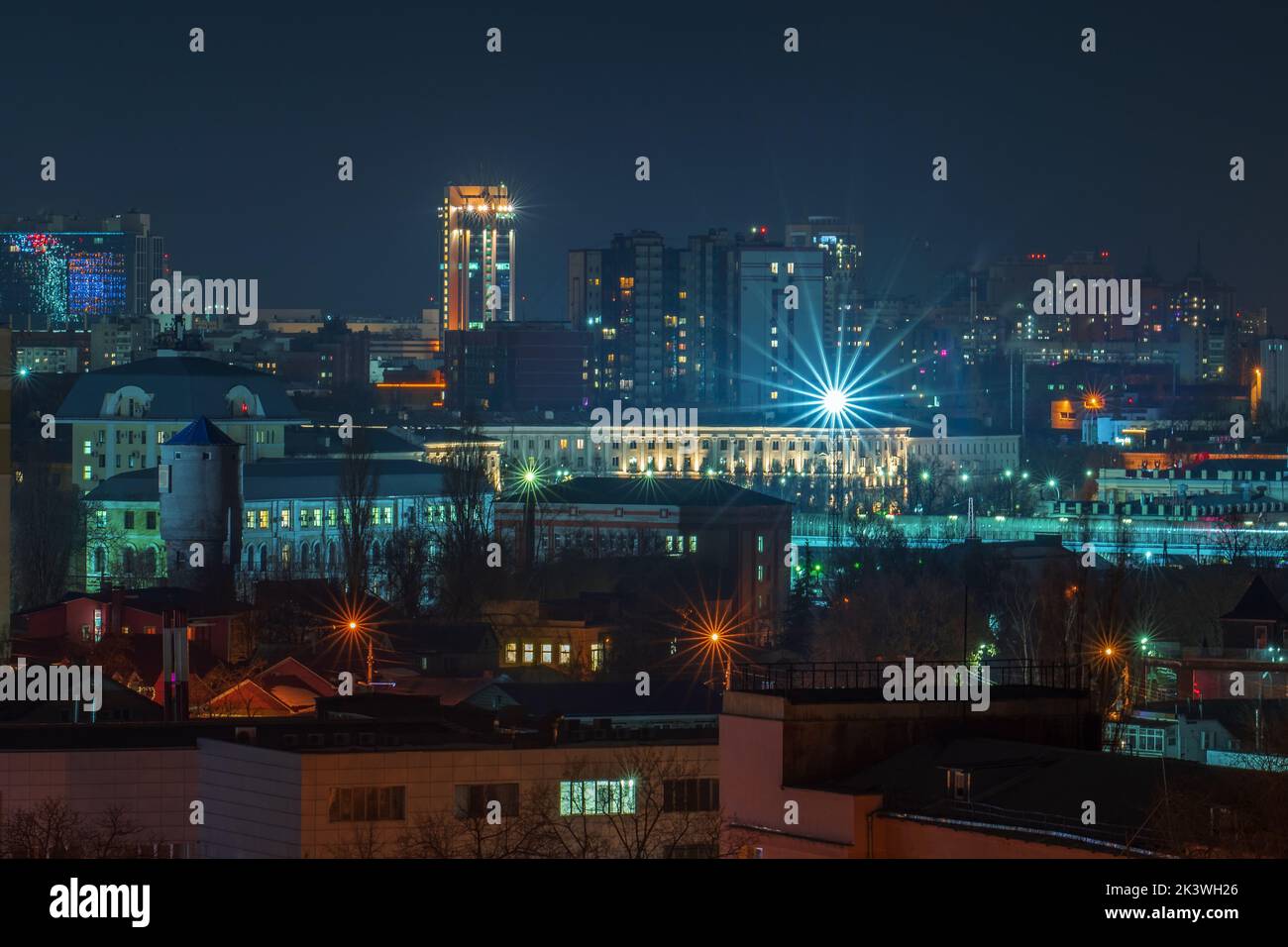 View at night city buildings with illumination. Stock Photo
