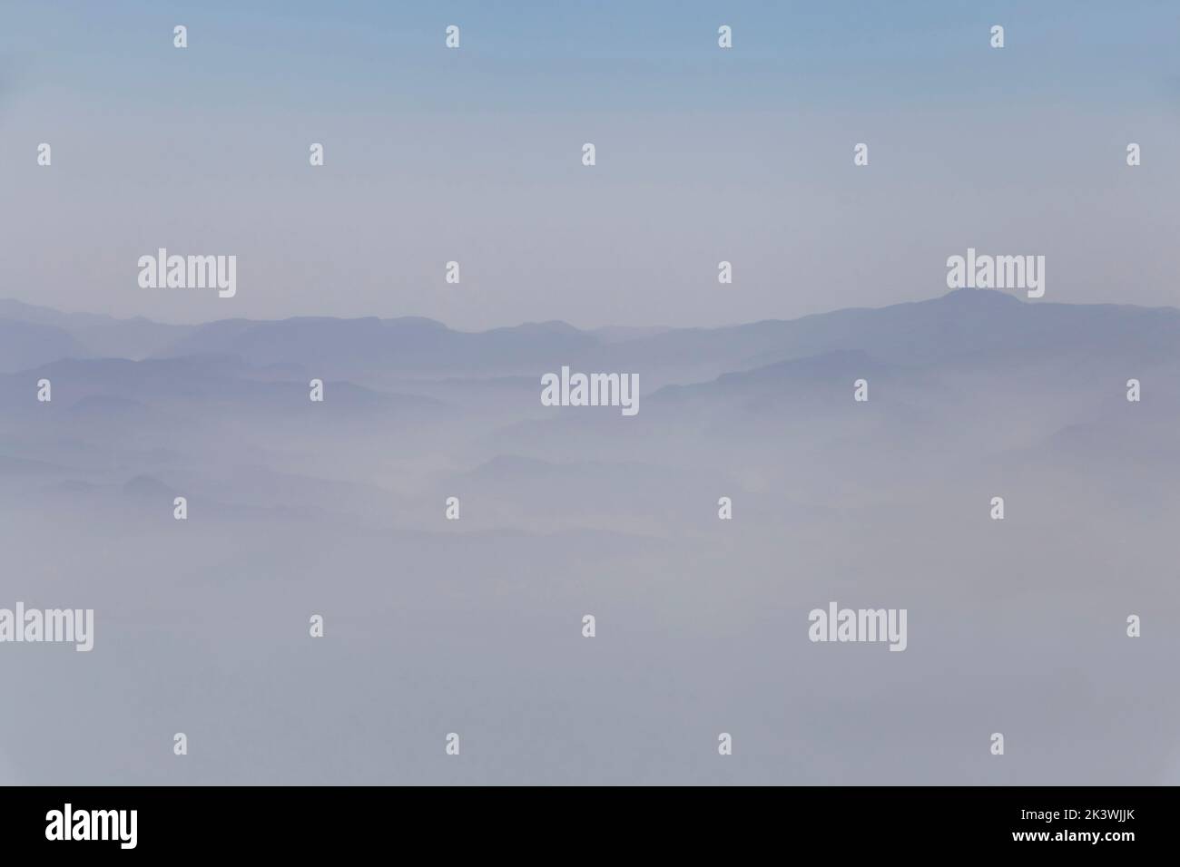 aerial view on peaks of Zagros mountains among clouds in Iran Stock Photo