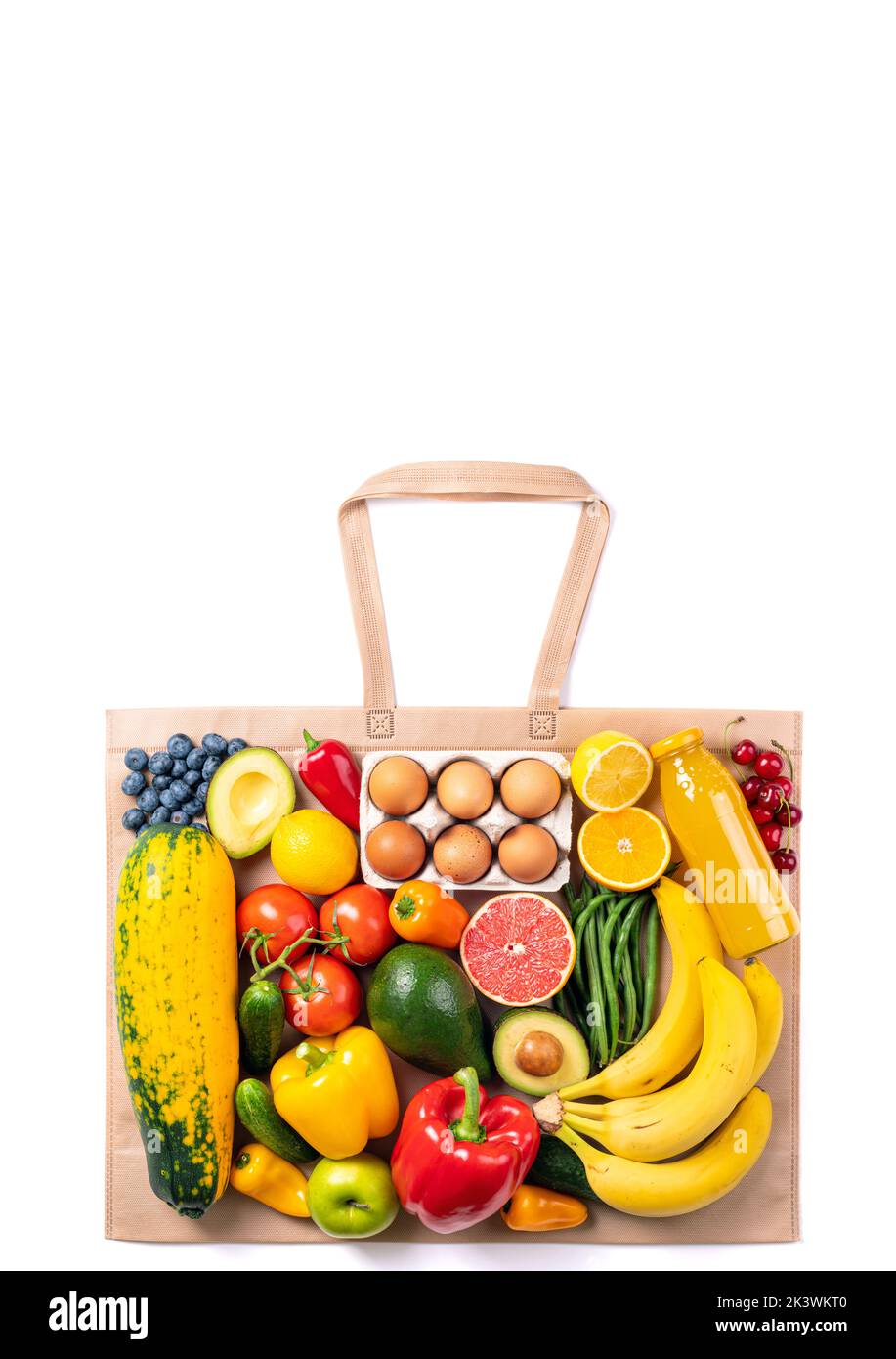 Healthy food background. Vegetarian healthy food in shopping bag vegetables, fruits, eggs on white. Shopping food supermarket concept. Copy space Stock Photo