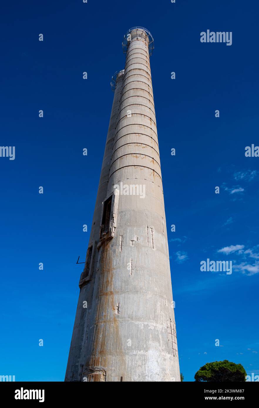 Twin chimneys remains of Cement Works demolished in Monopoli, Italy Stock Photo