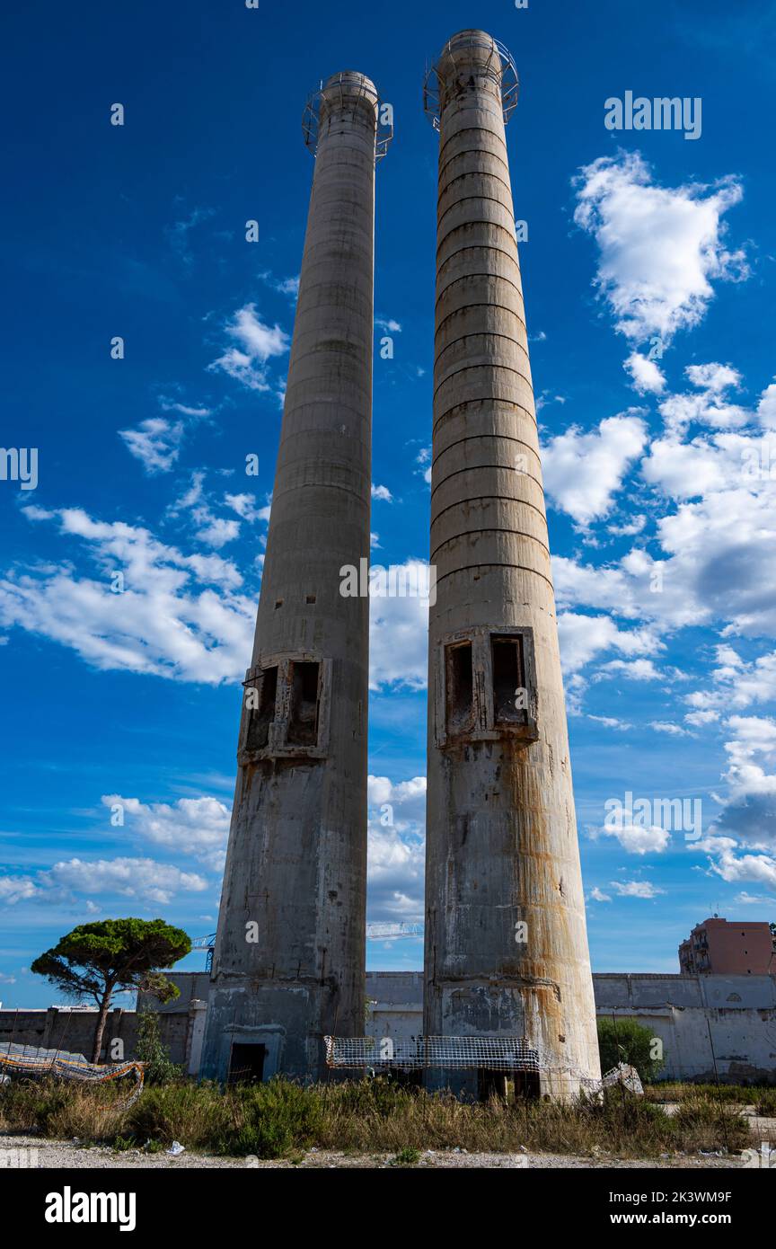 Twin chimneys remains of Cement Works demolished in Monopoli, Italy Stock Photo