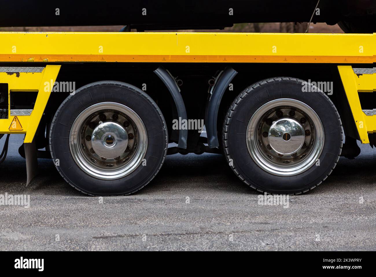 Big truck tire. Heavy vehicle axle. Stock Photo