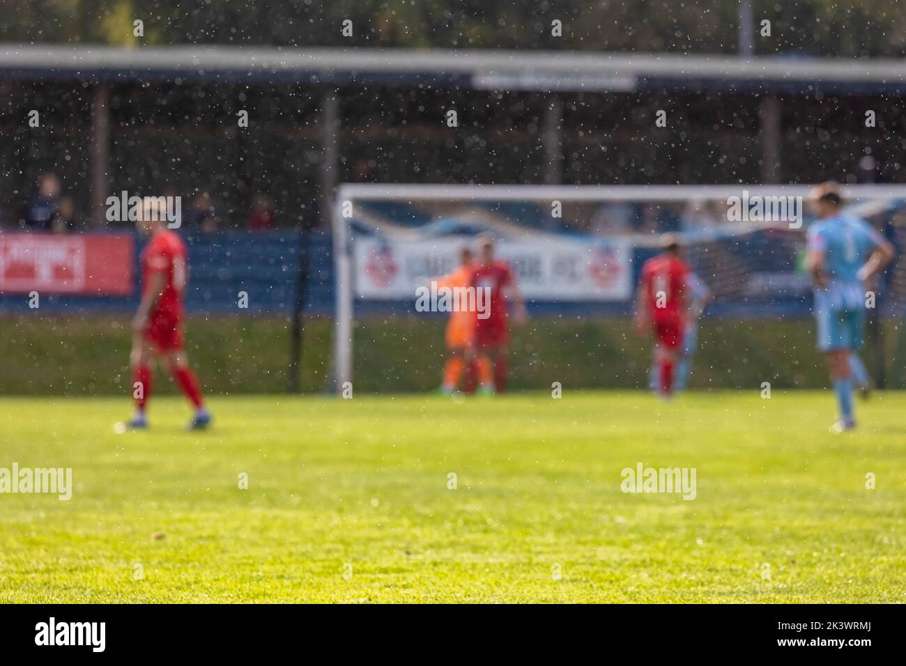 Liversedge hosted Warrington Rylands for a football match in the Northern Premier League Premier Division. It rained through the sun Stock Photo