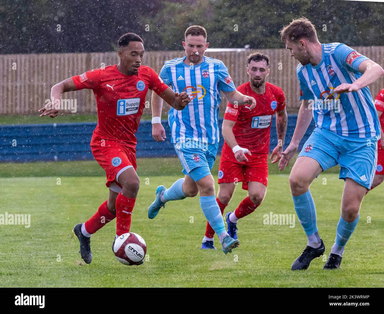 Liversedge hosted Warrington Rylands for a football match in the Northern Premier League Premier Division. Niah Payne runs at the Liversedge defenders Stock Photo