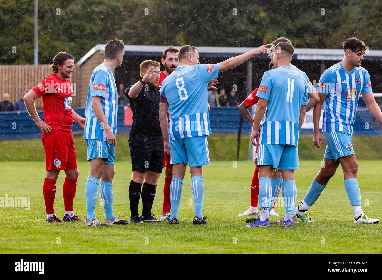 Liversedge hosted Warrington Rylands for a football match in the Northern Premier League Premier Division. Liversedge players surround the referee Stock Photo