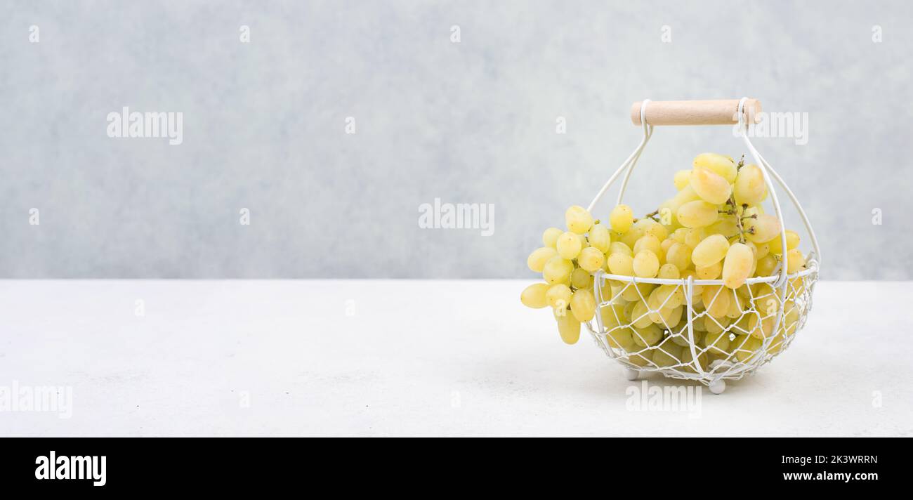 Grapes in a basket , fresh ripe fruits in autumn, healthy food Stock Photo