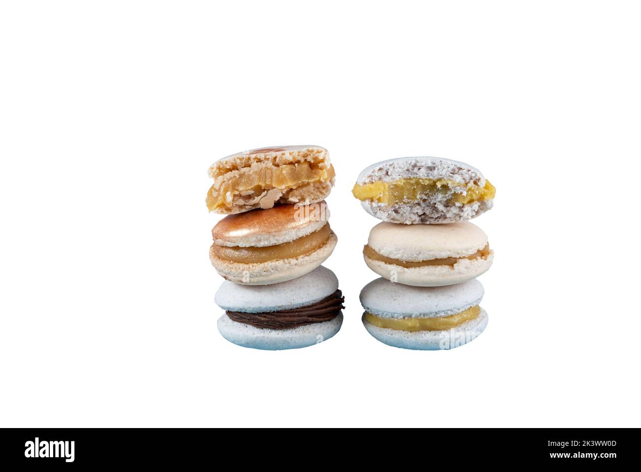 Closeup of a stack of macarons filled with chocolate ganache, dulce de leche and passion fruit cream white background. Stock Photo