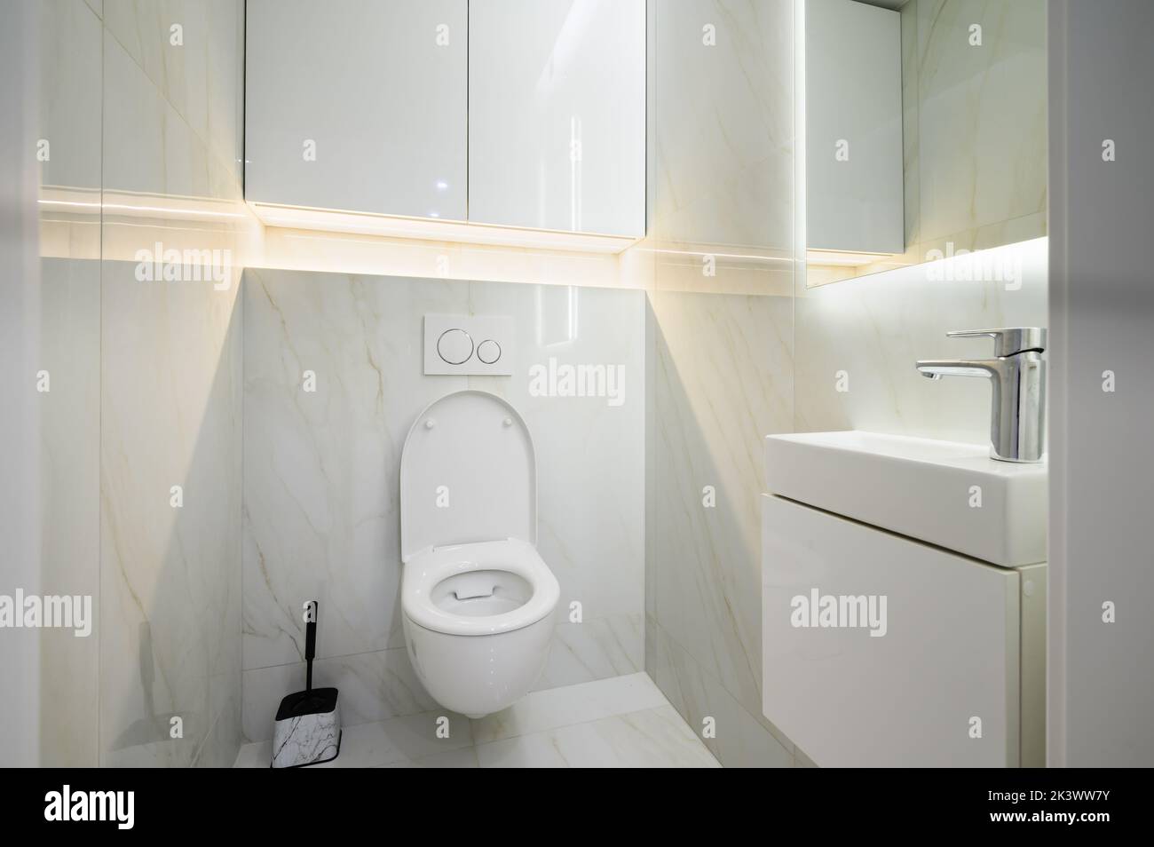 New ceramic toilet bowl in a white toilet room Stock Photo Alamy