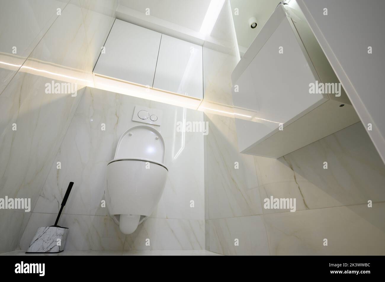 New ceramic toilet bowl in a white toilet room Stock Photo