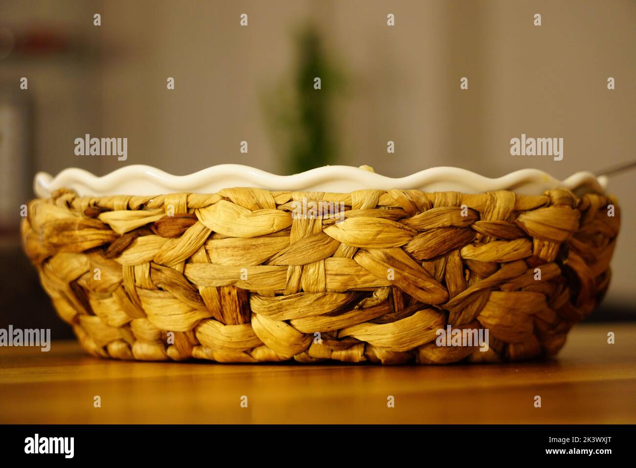 The close-up view of a decorative bowl over the wooden surface Stock Photo