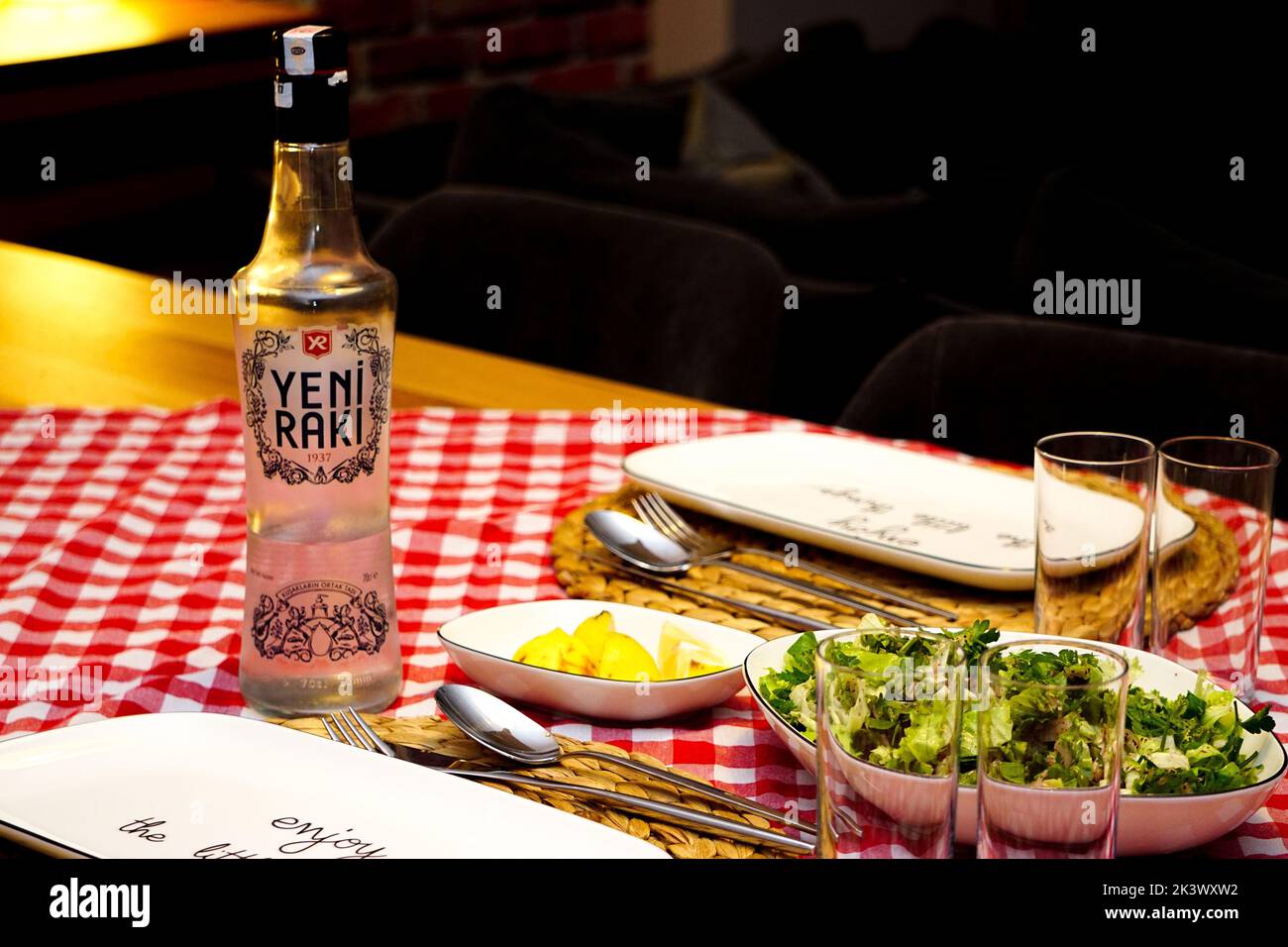 A Turkish raki and roasted bonito fish on the table Stock Photo