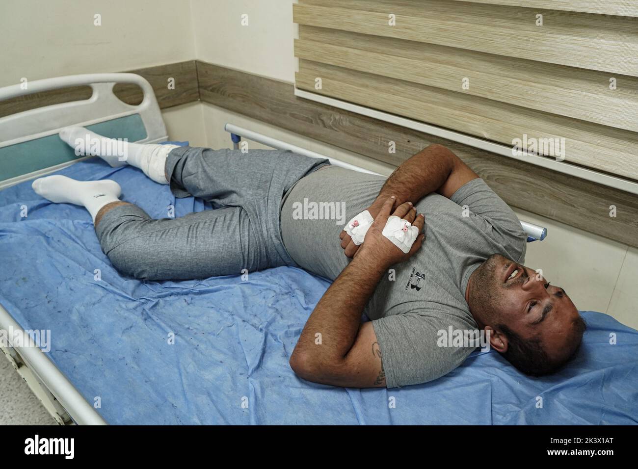 28 September 2022, Iraq, Erbil: A wounded member of the opposition Kurdistan Freedom Party (PAK) lies on a bed at a hospital following attacks by Iranian explosives-laden drones and rockets targeting the opposition Kurdistan Freedom Party (PAK), the Kurdistan Democratic Party of Iran (KDPI), the Free Life Party of Kurdistan (PJAK), and Komala in the provinces of Erbil and Sulaymaniyah, Kurdish media reported. The death toll from the attacks on opposition groups in the autonomous region of Kurdistan rose to nine and at least 32 were also injured, Iraq's state news agency INA quoted Barzinji as Stock Photo
