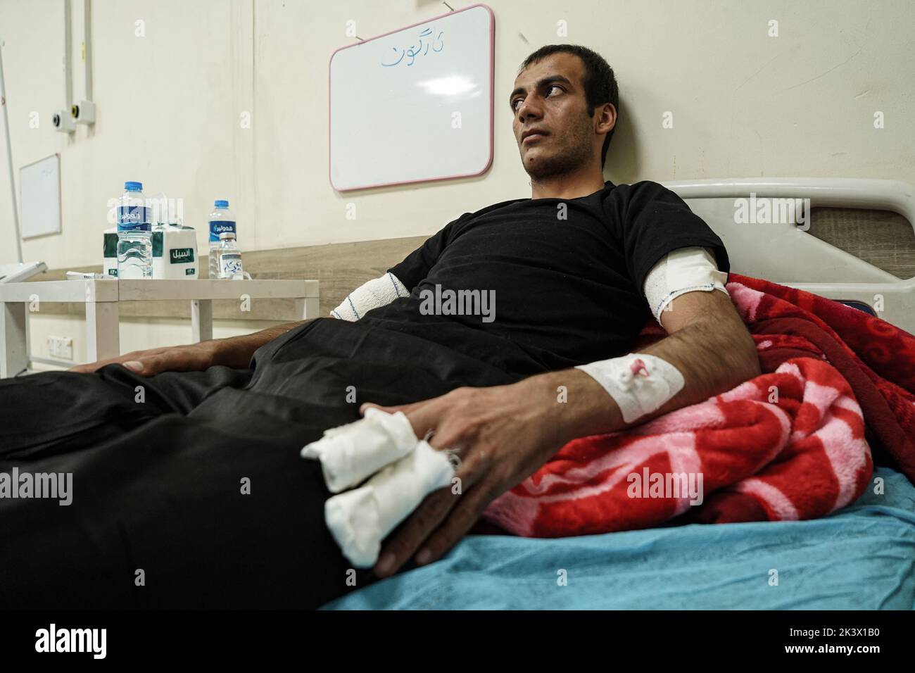 28 September 2022, Iraq, Erbil: A wounded member of the opposition Kurdistan Freedom Party (PAK) lies on a bed at a hospital following attacks by Iranian explosives-laden drones and rockets targeting the opposition Kurdistan Freedom Party (PAK), the Kurdistan Democratic Party of Iran (KDPI), the Free Life Party of Kurdistan (PJAK), and Komala in the provinces of Erbil and Sulaymaniyah, Kurdish media reported. The death toll from the attacks on opposition groups in the autonomous region of Kurdistan rose to nine and at least 32 were also injured, Iraq's state news agency INA quoted Barzinji as Stock Photo