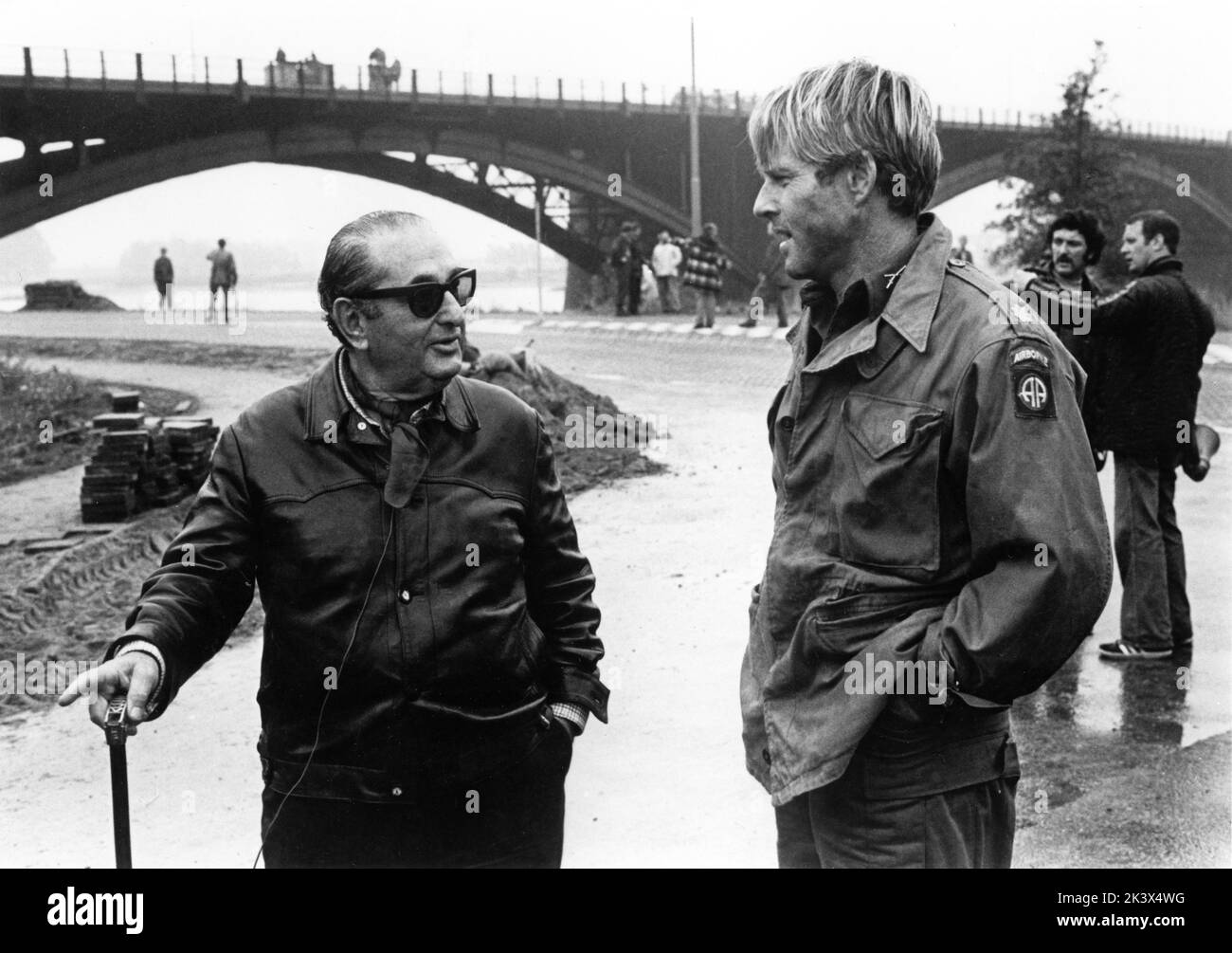 Producer JOSEPH E. LEVINE and ROBERT REDFORD on set location candid in Holland during filming of A BRIDGE TOO FAR 1977 director RICHARD ATTENBOROUGH screenplay William Goldman based on the book by Cornelius Ryan USA - UK co-production Joseph E. Levine Productions / United Artists Stock Photo