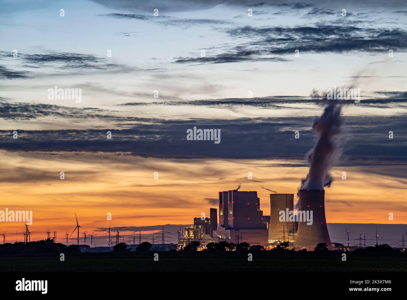 The RWE lignite-fired power plant Neurath, near Grevenbroich, largest German coal-fired power plant, second largest in Europe, unit F-G, wind farm, su Stock Photo