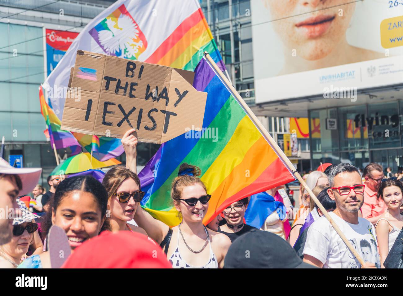 June 25, 2022 Warsaw, Poland - Equality parade in Warsaw, Poland. Huge crowd of diverse people marching with LGBTQ flags and powerful protest signs. Fighting back against homophobia. High quality photo Stock Photo