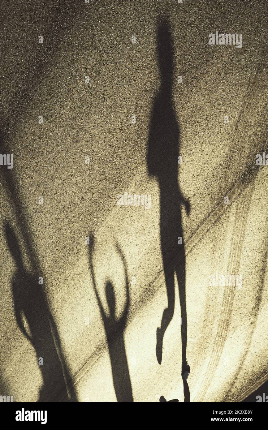 Top view of Competitors with shadows running in the half marathon are running special for the