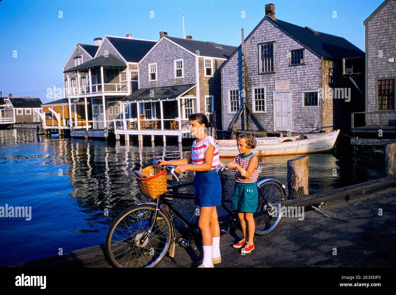 Two Young Girls with Tandem Bicycle, Nantucket, Massachusetts, USA, Toni Frissell Collection, September 1957 Stock Photo