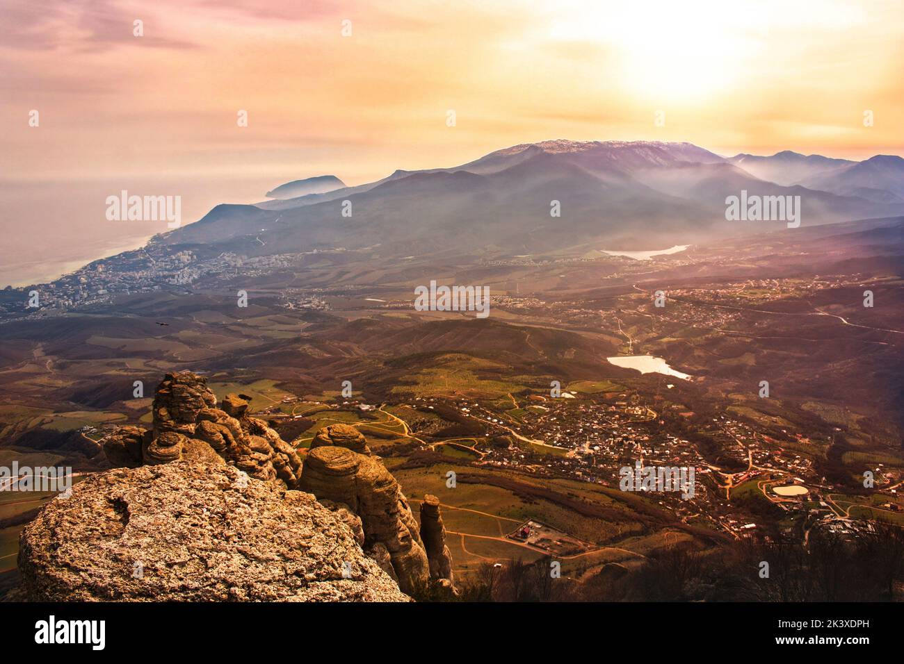Beautiful sunset in the mountains of Crimea, view of the city of Alushta from Mount Demerdzhi. High quality photo Stock Photo