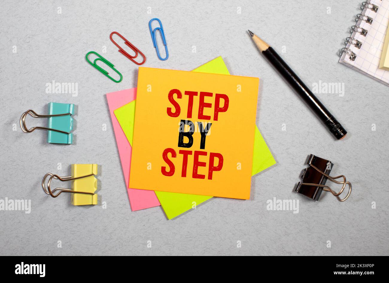 step by step word written on wood block. step by step text on table ...