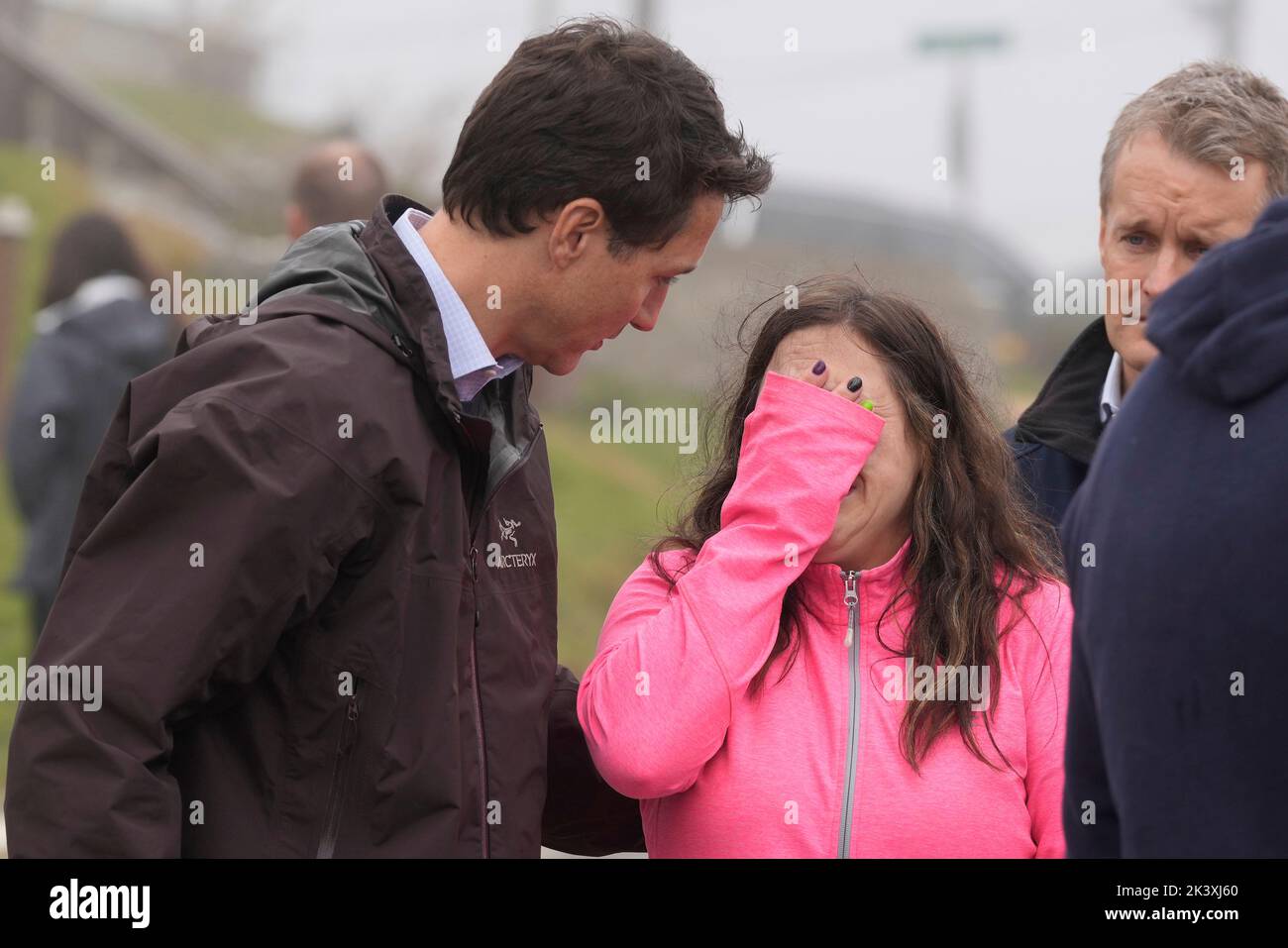 Prime Minister Justin Trudeau comforts resident Amy Osmond during his ...