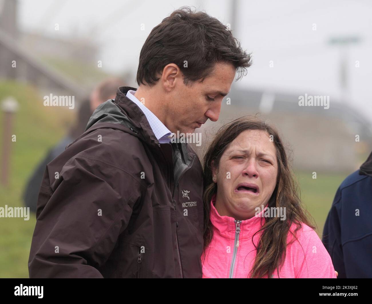 Prime Minister Justin Trudeau comforts resident Amy Osmond during his ...